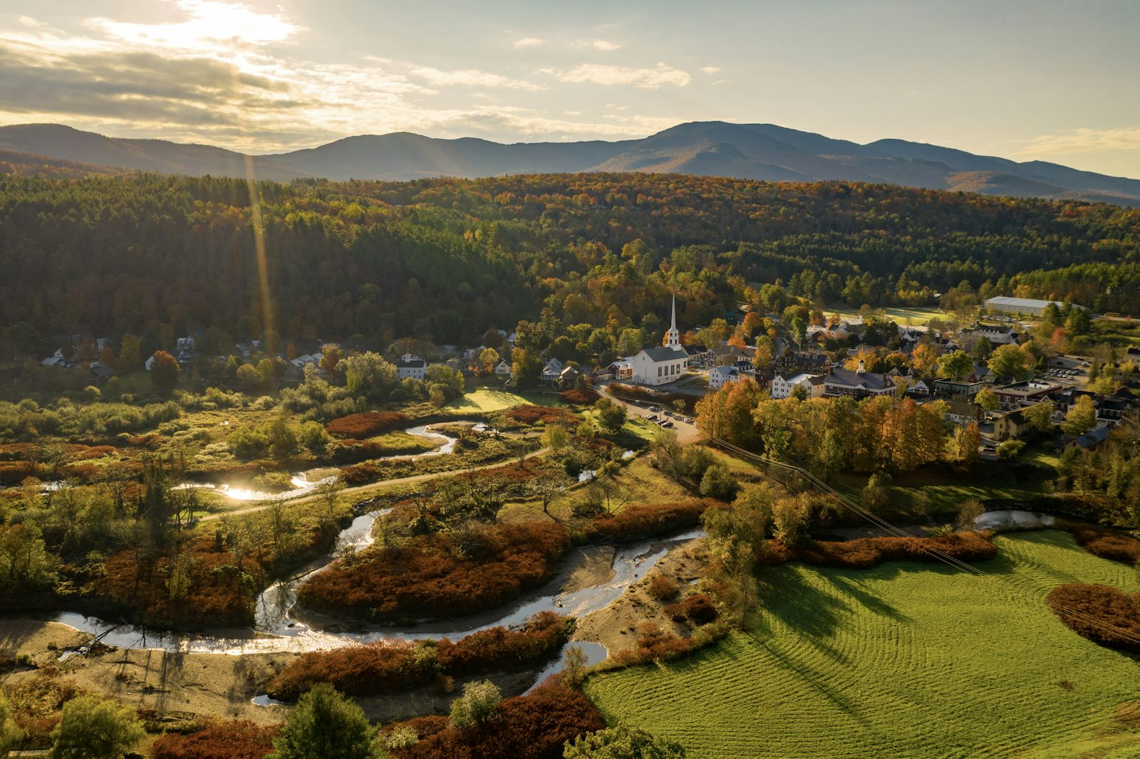 Aerial View Small Mountain Town Surrounded by Forested Ridges